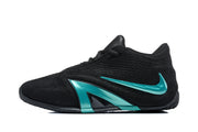 Side profile of a black basketball shoe with a green Nike swoosh and green midsole detail