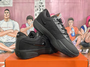 Angled view of two black Nike basketball sneakers showing the side branding, padded collars, and rubber outsoles.