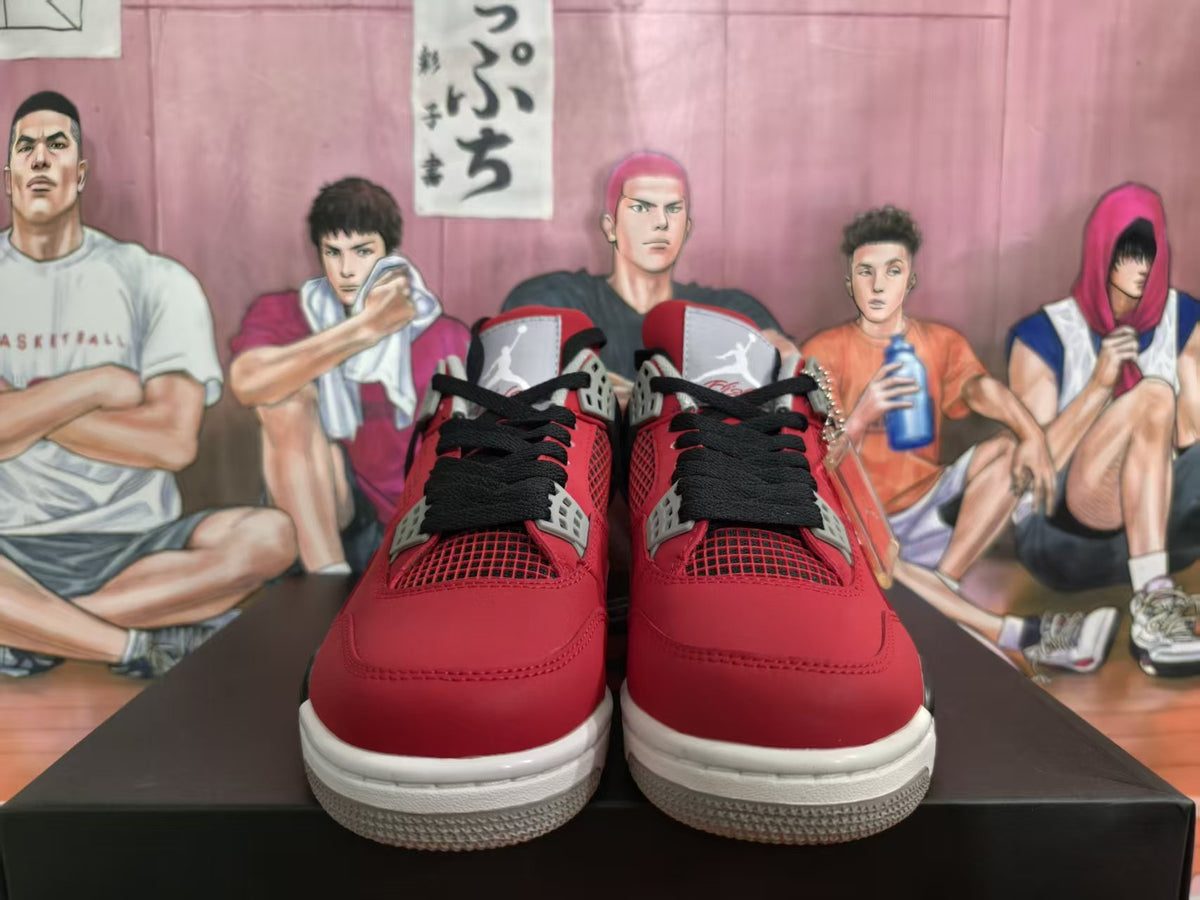Front view of red and black high-top sneakers with black laces, gray eyelet details, and white soles.