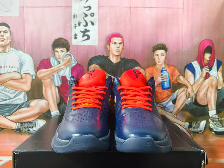 Front view of navy blue Nike Kobe basketball shoes with orange-red laces and tongue logos