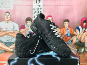 Black and white Nike basketball sneakers displayed from an angled side view, showing the textured upper and outsole.