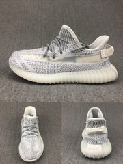 White and grey knit-style sneaker shown from the side with front and rear views below.