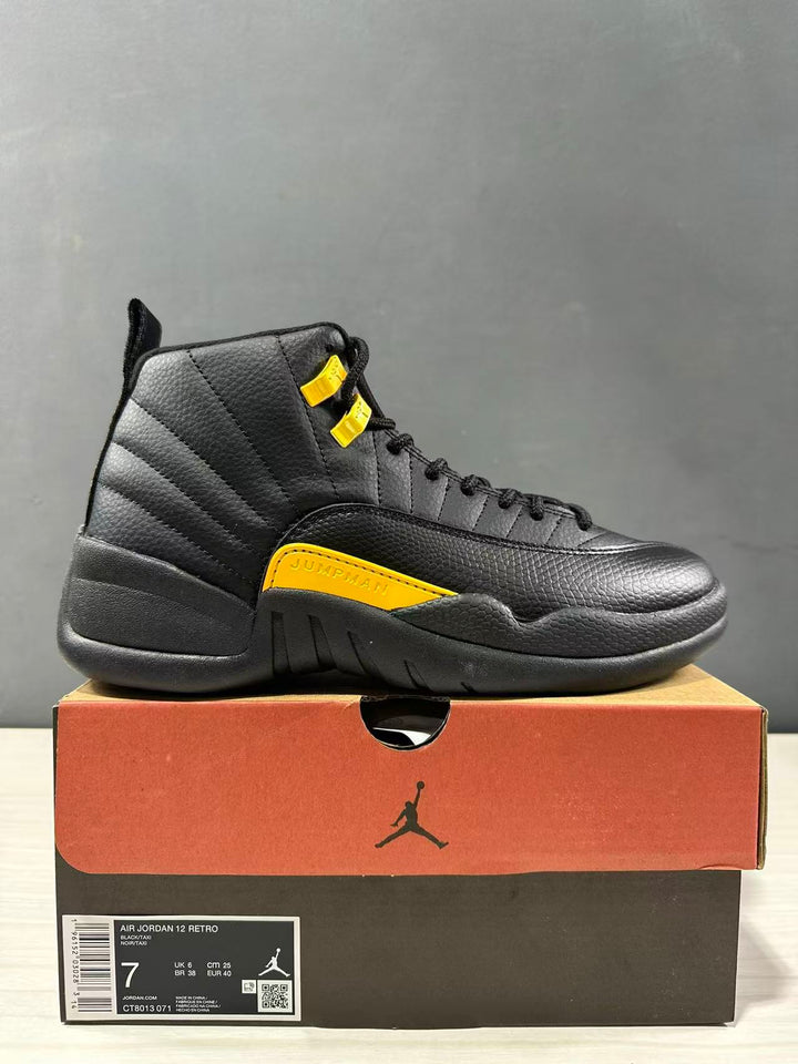 Side view of a black and yellow Jordan Air Jordan 12 Retro sneaker displayed on its shoebox; the box label shows size 7, EU 40 and style code CT8013-071.