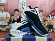 Pair of black, white, and blue Jordan basketball shoes shown from side and outsole angles.