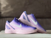 Angled side view of the pair showing the textured gradient upper, light-colored Swoosh, and pink midsole.