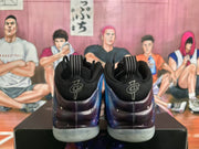 Rear view of black Nike sneakers with galaxy-patterned side panels and translucent outsoles.