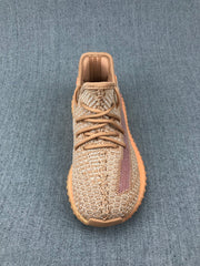 Top view showing the woven upper, brown laces, and muted purple side stripe.