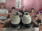 Rear view of the pair showing Nike heel branding, white heel panels, and speckled gray soles.