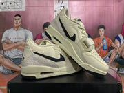 Two views of cream-and-black low-top sneakers showing the strap, laces, and side accents