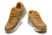 Front and angled views of ochre and brown Nike Air Max BW sneakers.