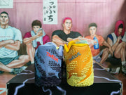 Rear view of the mismatched sneakers showing textured heel panels and contrasting colored details.