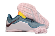 Blue, pale pink and yellow Nike LeBron 23 basketball shoe shown beside a pale pink outsole.