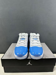 Front view of the pair showing white laces, blue toe panels, and low-top collars.