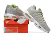 Nike Air Max 95 sneakers displayed on a red Nike box; the box label shows sample size EU 42, US Men 8.5, and UK 7.5.