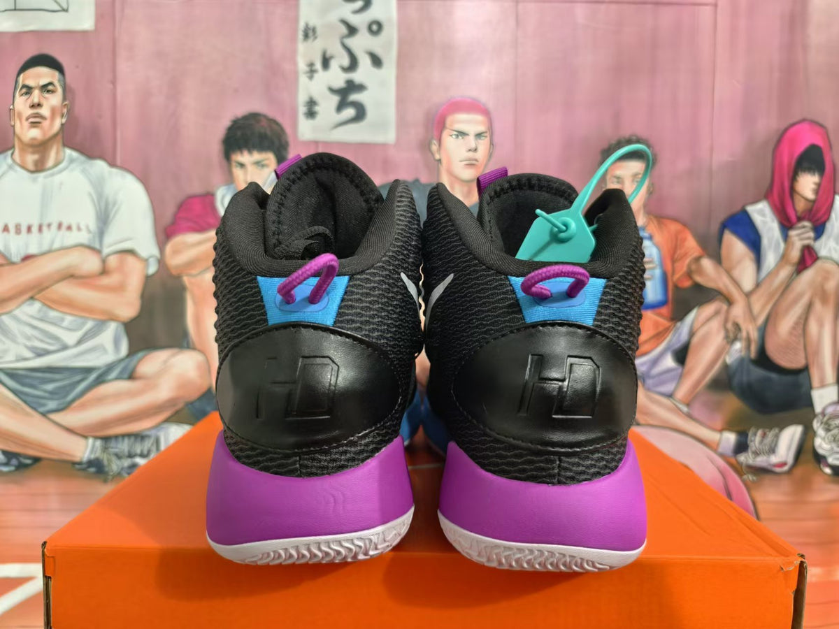Rear view of black basketball shoes with blue and purple heel accents and white outsoles.