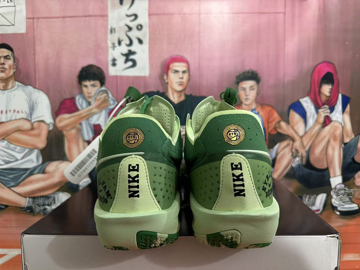Heel view of green Nike basketball shoes with EYBL details and pale green midsoles.
