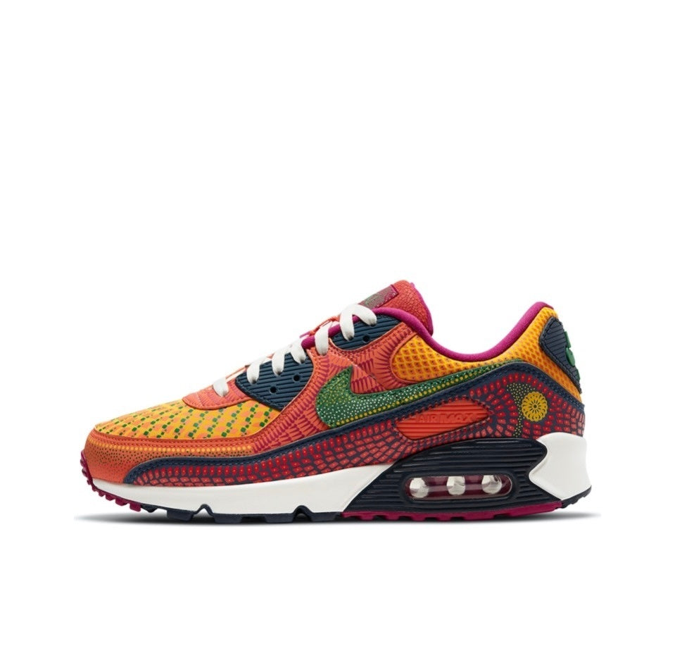Side view of multicolor patterned Nike Air Max sneakers with white laces and a visible Air unit.