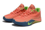 Pair of coral and green Nike S.T. Flare EP sneakers shown from the front three-quarter angle.