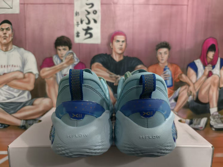 Rear view of blue basketball sneakers showing heel details and pull tabs