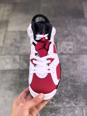 Top view showing the red toe area, white laces, red tongue, and black Jumpman branding.