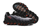 Side profile and outsole of black and grey Nike Air Max DN8 sneakers.