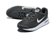 Top and angled views of black Nike Air Max Verse sneakers with white Swoosh details.