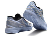 Blue-gray camouflage Nike Ja 2 shoes shown from rear and outsole angles