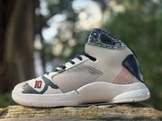 Side and toe view showing the gray upper, white midsole, patterned collar, and number 10 detail.