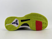 Underside view showing the green tread and red outsole insert.