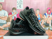 Two black Nike GT Cut 3 basketball shoes shown at an angle, highlighting the laces and side details.