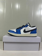 Side view highlighting the blue overlays, white panels, black branding, and cream-colored midsole.