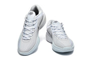 Pair of light blue and white Nike GT Cut sneakers shown from the front at an angle.