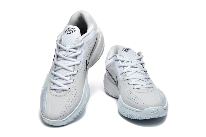 Pair of light blue and white Nike GT Cut sneakers shown from the front at an angle.