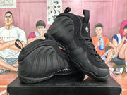 Pair of all-black high-top sneakers arranged to show the sculpted side panels and lace-up design.