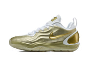 Side profile of a white and gold Nike 511-2 sneaker showing the gold Swoosh, layered upper, and sculpted sole.