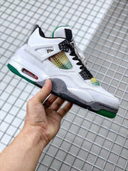Side profile highlighting the white upper, multicolor mesh, gray speckled midsole, and green outsole.