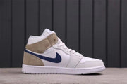 Lateral side view showing the dark blue Swoosh, tan overlays, and white midsole.
