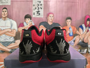 Rear view showing black heel panels, red collars, and gray graphic heel detailing.