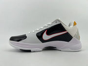 Side profile showing black side panel, white Swoosh with red trim, and light-colored sole