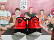 Rear view showing the red heels, black midsoles, white outsoles, and circular GT details.