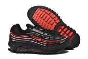 Black and red sneakers shown with a close view of the outsole tread.