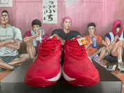 Front view of red and white Nike basketball sneakers with red laces and white midsoles.