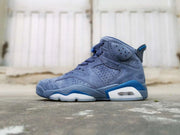 Opposite side profile showing the blue upper, lace-up construction, and white-and-blue outsole.