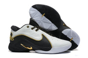 Sneakers displayed at an angle with one outsole visible, showing the black-and-white traction pattern.
