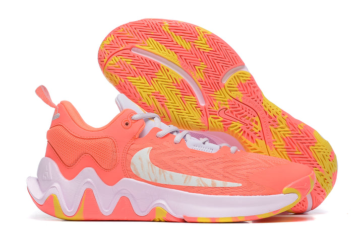 Bright coral-pink Nike KD basketball shoes with yellow accents and patterned outsole.