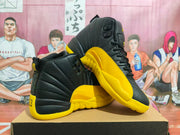 Black and yellow high-top sneakers shown from an angled side view on a box.