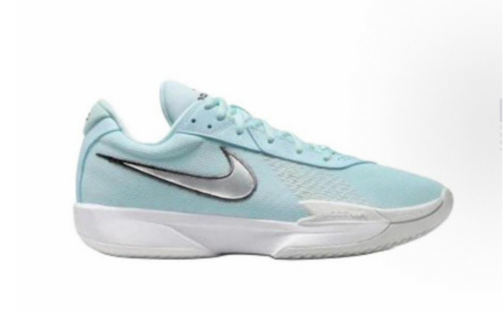 Side view of blue Nike sneakers with a contrasting Swoosh and white sculpted outsole.