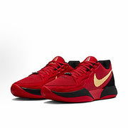 Red Nike basketball sneakers with a gold Swoosh and black outsole accents.