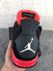Rear view showing the black heel panel, white Jordan logo, and red collar lining.