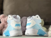 Rear view of Nike HD2008 kids sneakers showing blue heel lettering and white midsoles.
